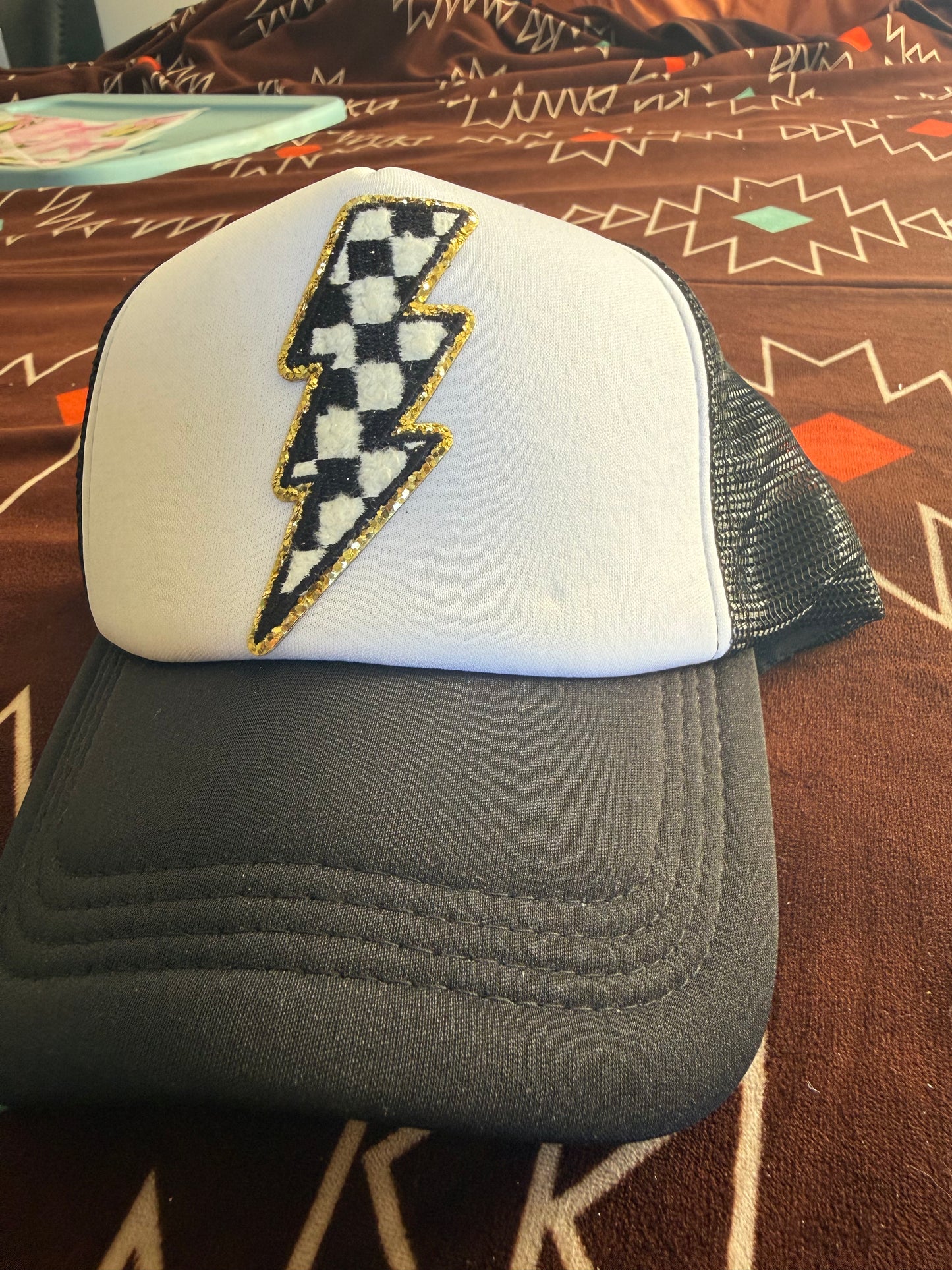Checkered lightening blot trucker hat